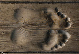 Ven. Hua Chi has prayed so often his footprints have become embedded in the wood