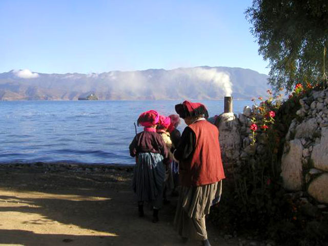 Musuo women at morning prayers Lugu Lake