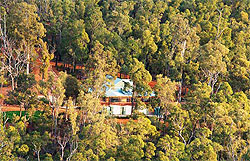 The Dhammasara Nuns Monastery in Perth, Australia is surrounded by lush greenery.