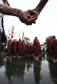 Saffron-robed monks chant the “Metta Sutta” in central Rangoon during a September demonstration