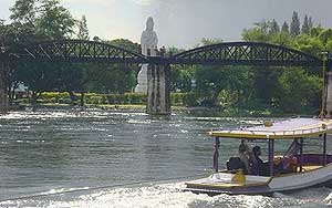 Kwai Bridge with Goddess of Mercy statue in the background