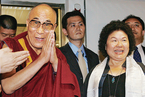 The mayor of Kaohsiung, Taiwan, greets the Dalai Lama at the airport Sunday.
