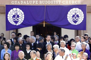 Past and present members of the Guadalupe Buddhist Church gather for a group photo Saturday to mark the church’s 100-year anniversary.