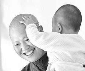 Master Zhihong named the baby girl abandoned at the nunnery gate Yuanyuan. She is now 9-months old and is starting to learn to walk.