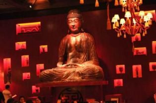 A large statue of the Buddha dominates the bar and dining area at Jakarta’s Buddha Bar.
