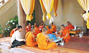 Wat Langka Monks eat lunch at Wat Langka, one of Phnom Penh's most famous Buddhist monasteries.