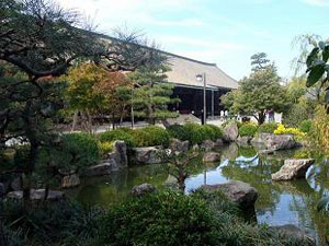 Japanese-style garden at Sanjusangen-do Buddhist Temple, Kyoto, Japan. The Main Hall can be seen in the background.