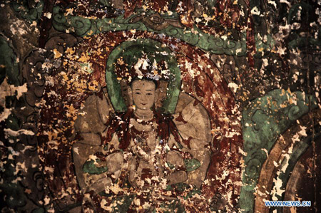 Le 17 juillet 2013, une partie d'une peinture murale vue dans les grottes du temple Bingling dans le district de Yongjing, la province chinoise du Gansu. [Photo: Xinhua]