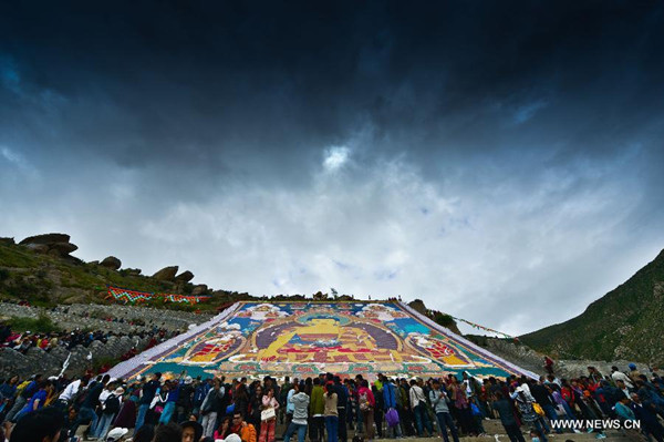 Buddhists and tourists participate in the sacred 