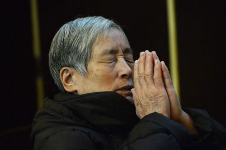 Un catholique chinois, le 20 février à Pékin. Crédits photo : MARK RALSTON/AFP