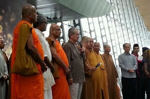 Abdullah Badawi (centre), a Muslim, sharing the stage with Buddhist monks before the interfaith prayers commenced at KLIA today. - Reuters pic, March 9, 2014.
