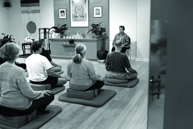 Instructor Mary Whetsell leads a group in a sitting meditation session at the Birmingham Shambhala Meditation Center. (The Birmingham News/Tamika Moore)