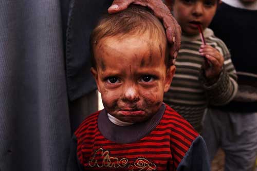 A displaced Syrian child in a makeshift camp for Syrian refugees in the Bekaa Valley, Lebanon(Getty)
